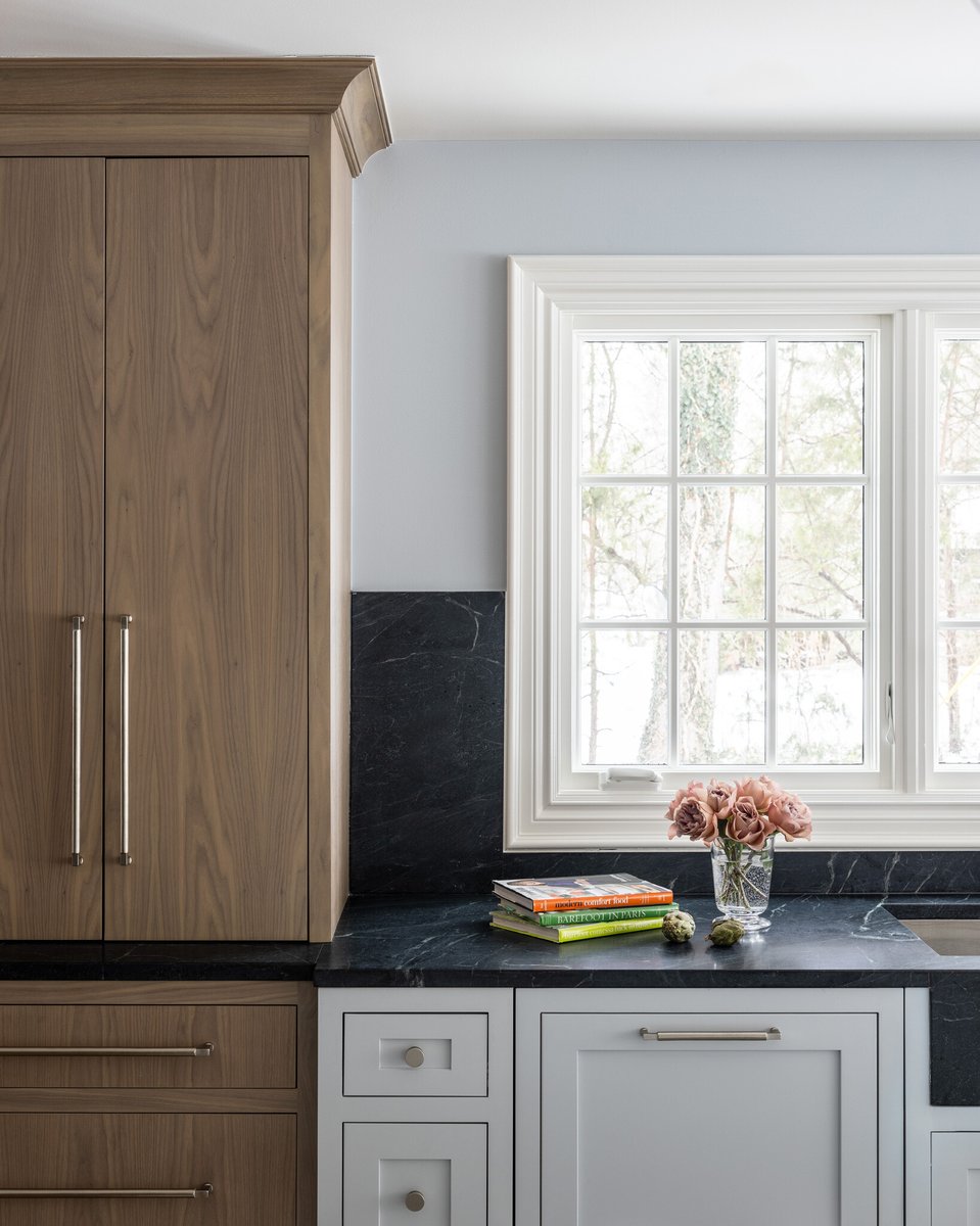 Mixing painted shaker inset cabinets with grain-matched walnut slab door inset cabinets