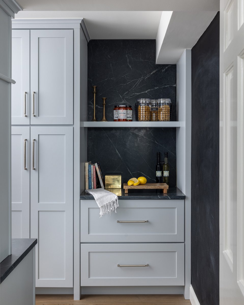 Desk and pantry cabinetry tie into kitchen selections