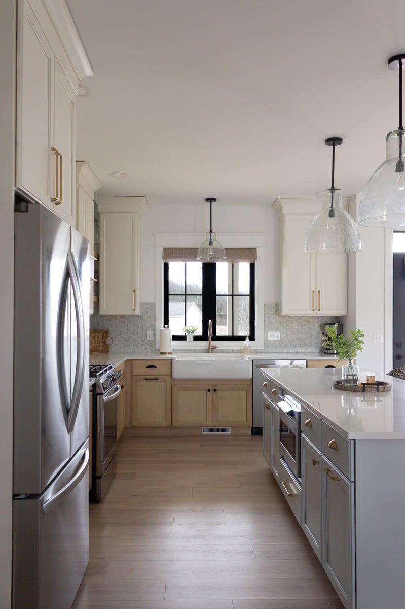 kitchen sink view featuring the island, refrigerator, and oven 