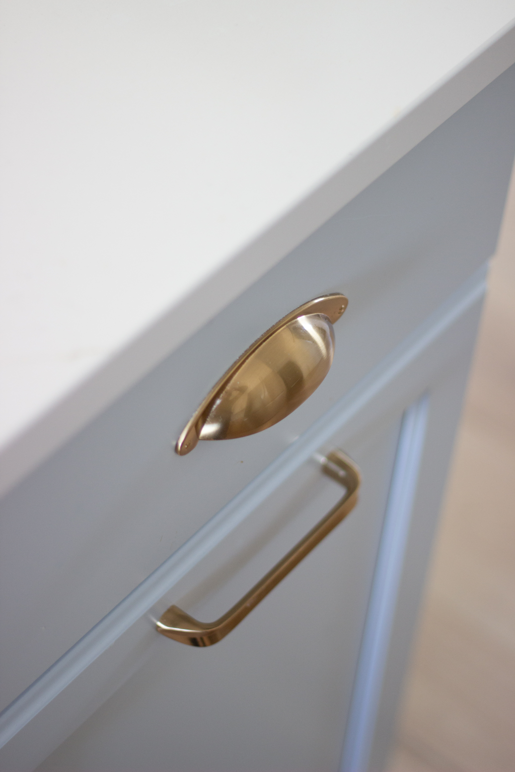 Gold kitchen hardware and a view of the SW North Star finish