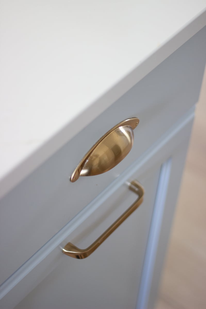 Gold kitchen hardware and a view of the SW North Star finish