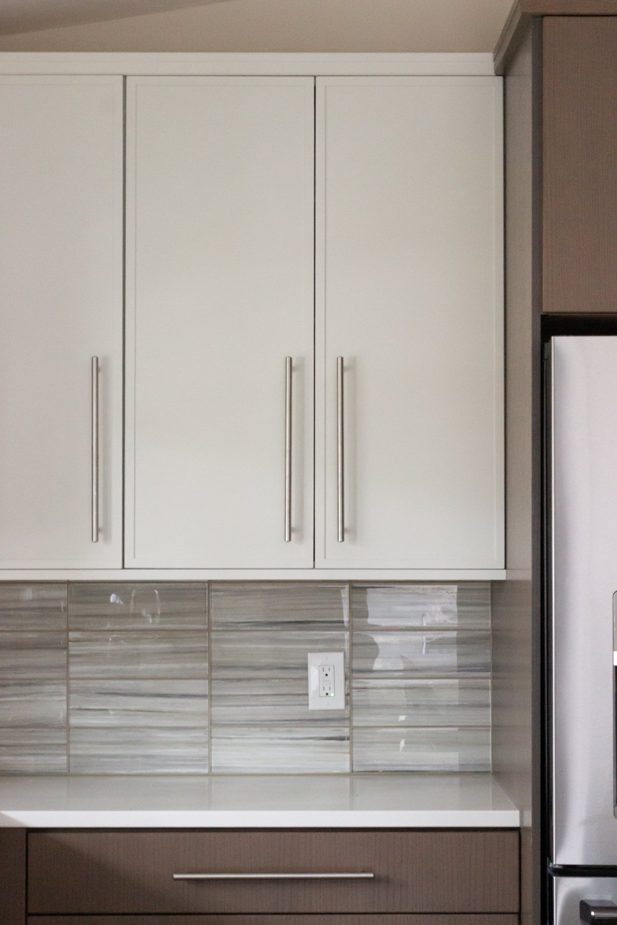 Eco-friendly rift-cut oak veneer cabinetry with a warm stain