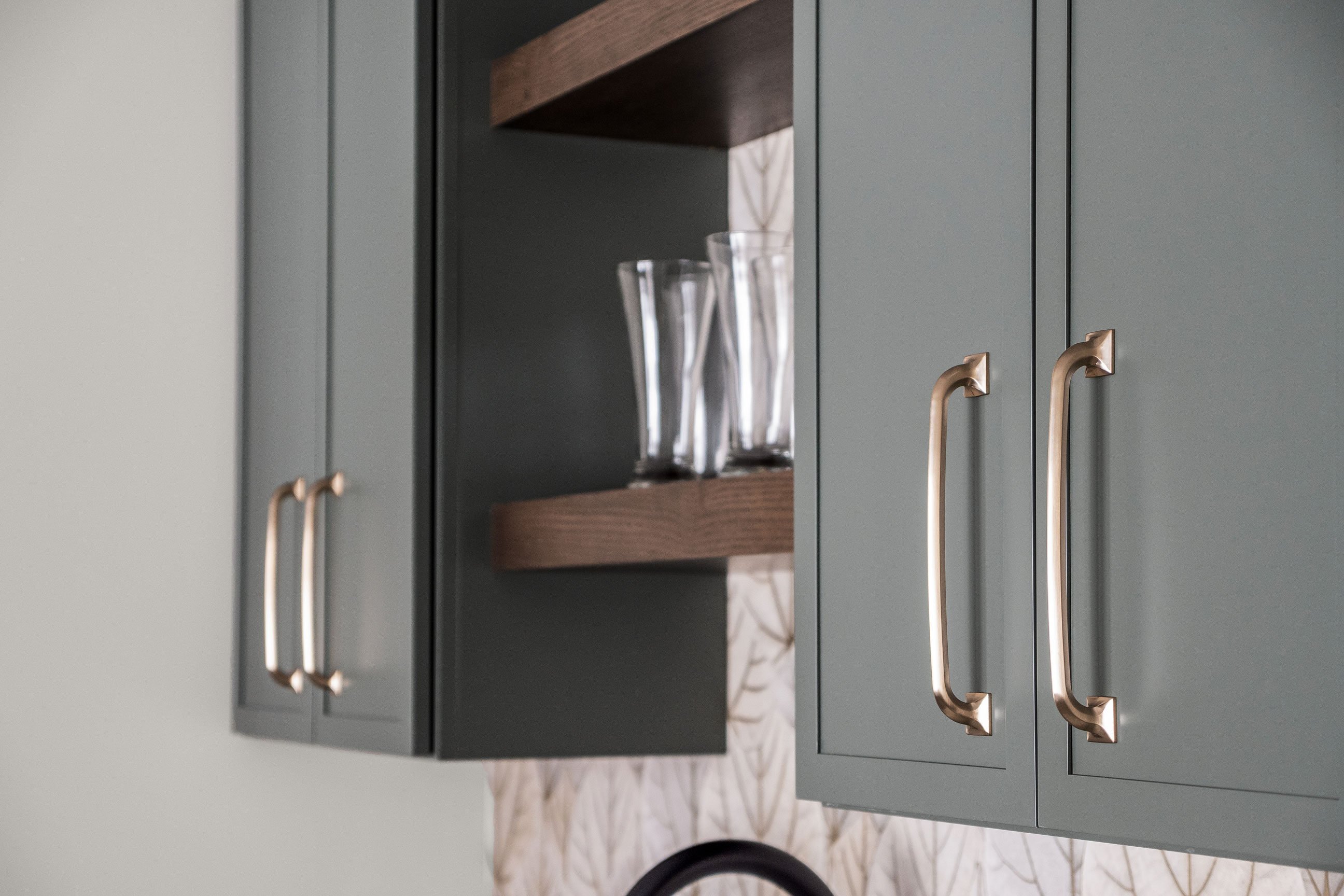 Pioneer Cabinetry - Medford door style in Pewter Green with Rift Cut White Oak shelves in Cobblestone finish