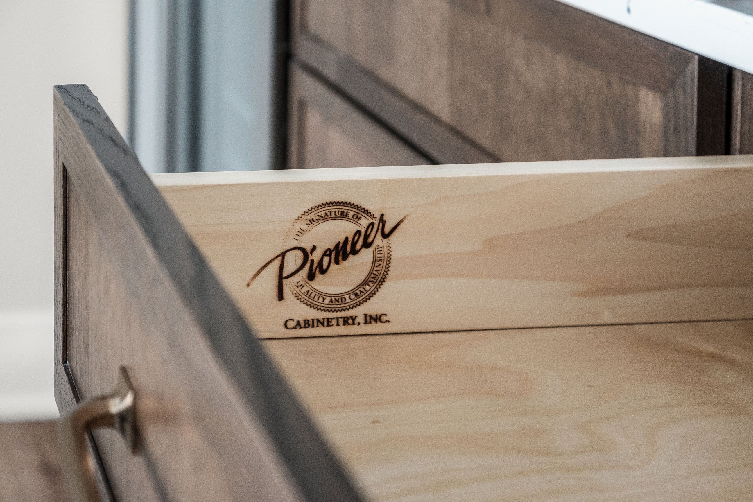 Pioneer Cabinetry - Medford door style in Rift Cut White Oak - Cobblestone finish