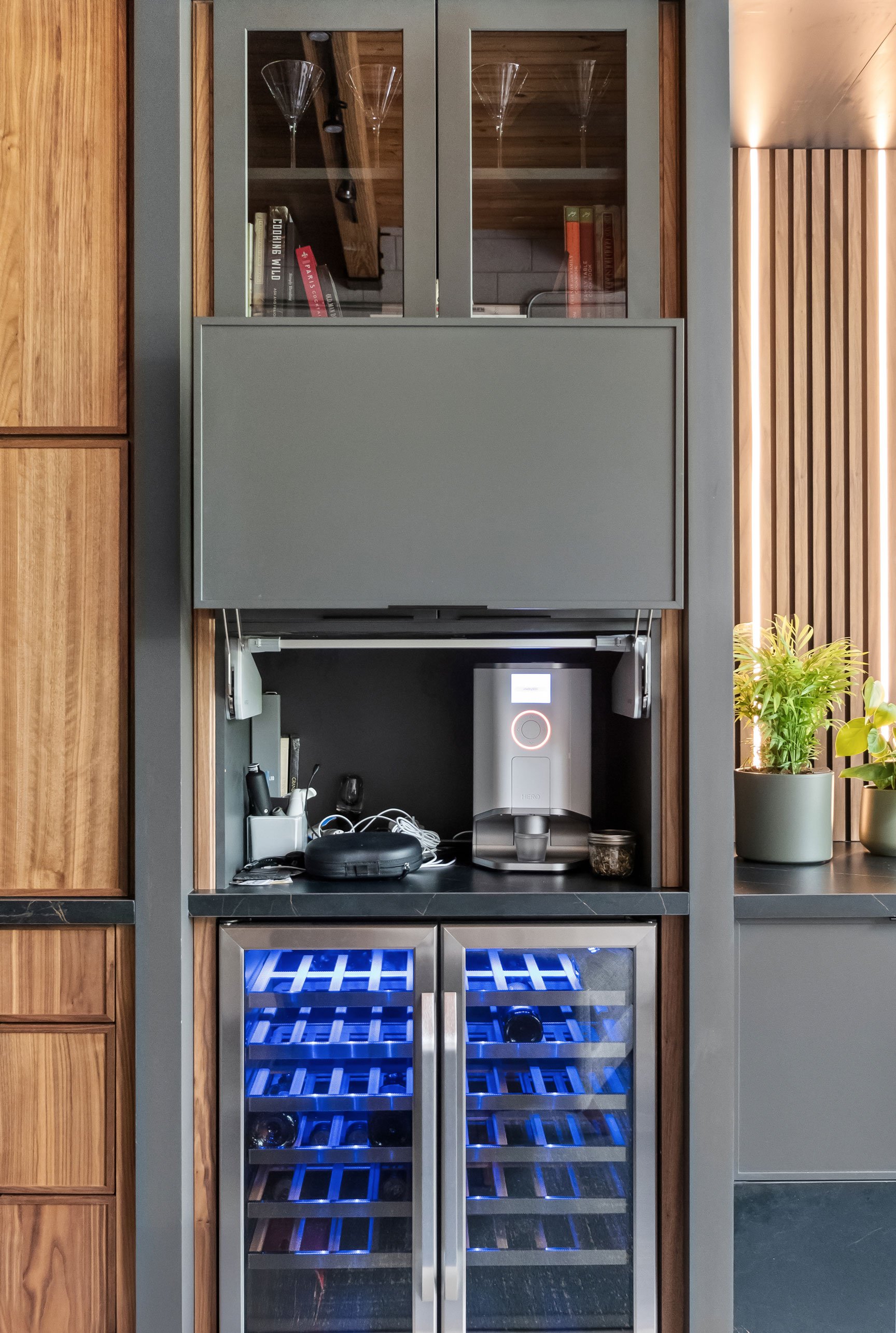 Contemporary loft entertainment area featuring natural walnut and black-painted Inspira Cabinetry - beverage center detail