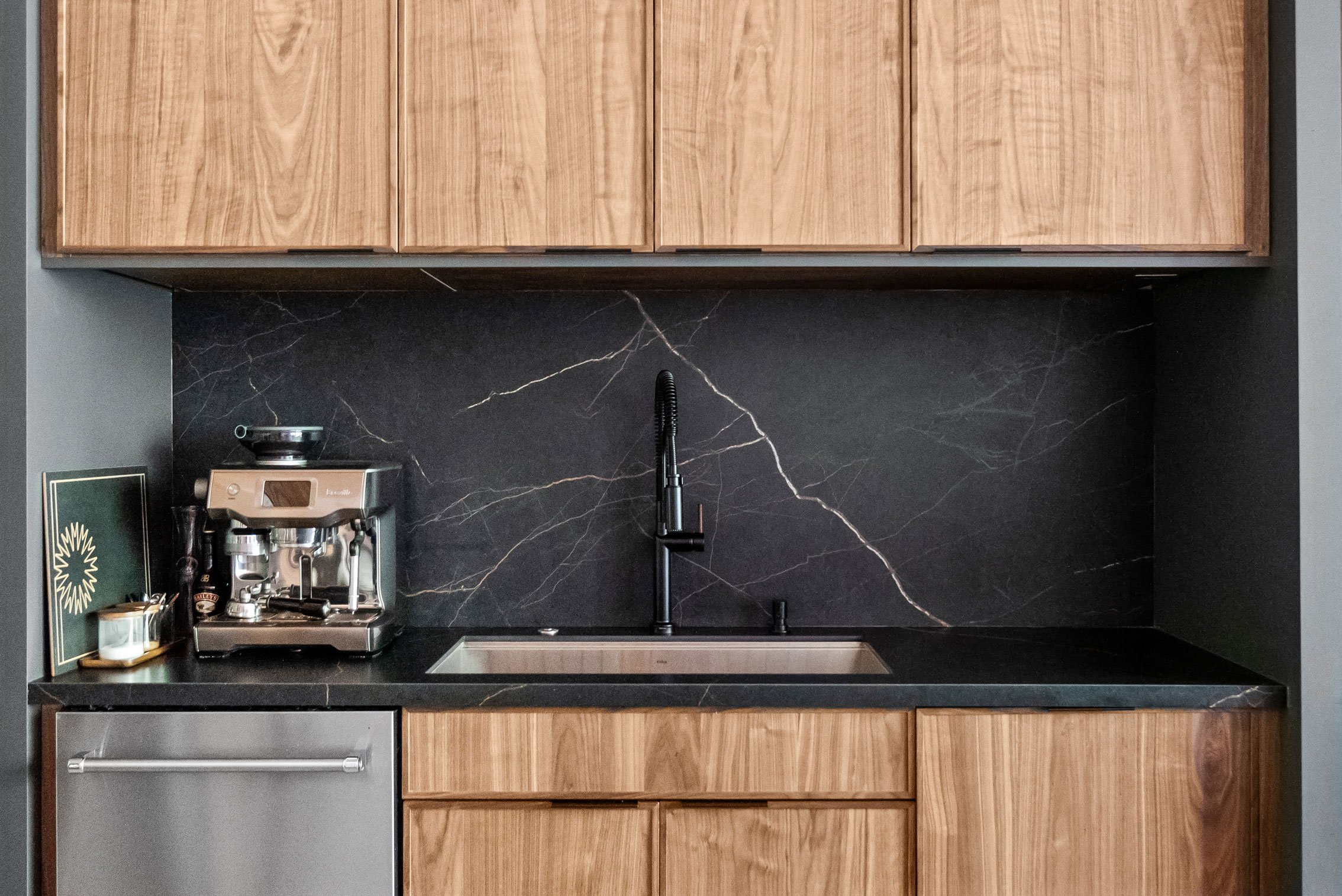 Contemporary loft kitchen featuring natural walnut and black-painted Inspira Cabinetry - sink detail