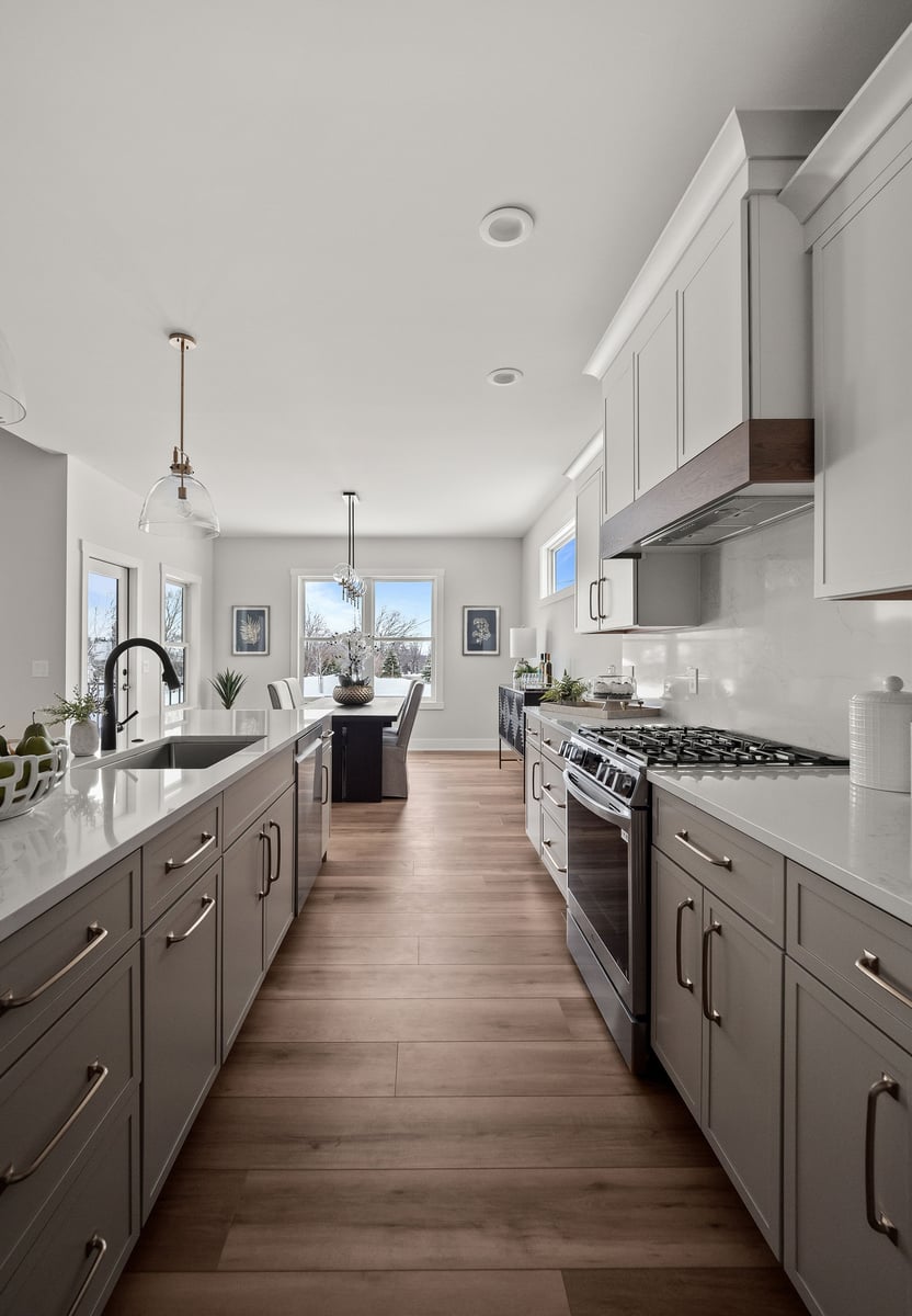 Pioneer Cabinetry - Medford door style in White (uppers) and Mushroom (lowers and island)