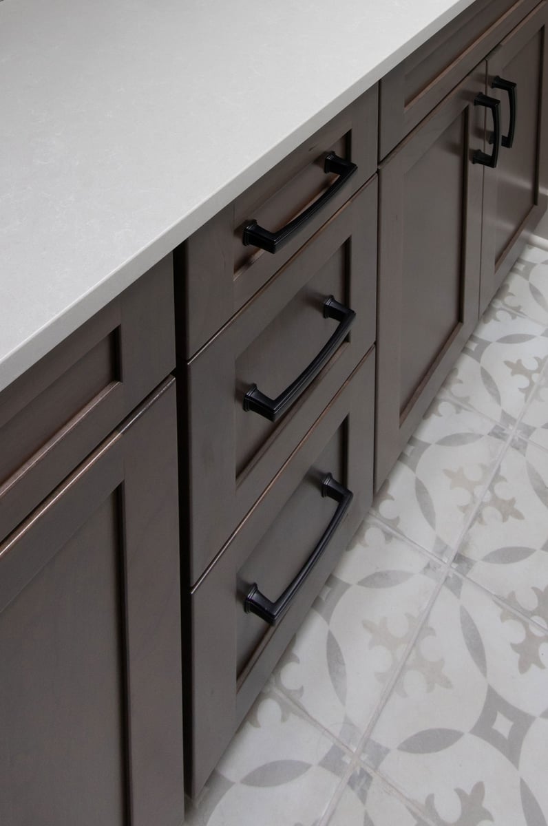 Merillat Masterpiece Martel Door style in Cherry Stained Baltic, Onyx White Quartz countertop, Decora Redondo floor tile