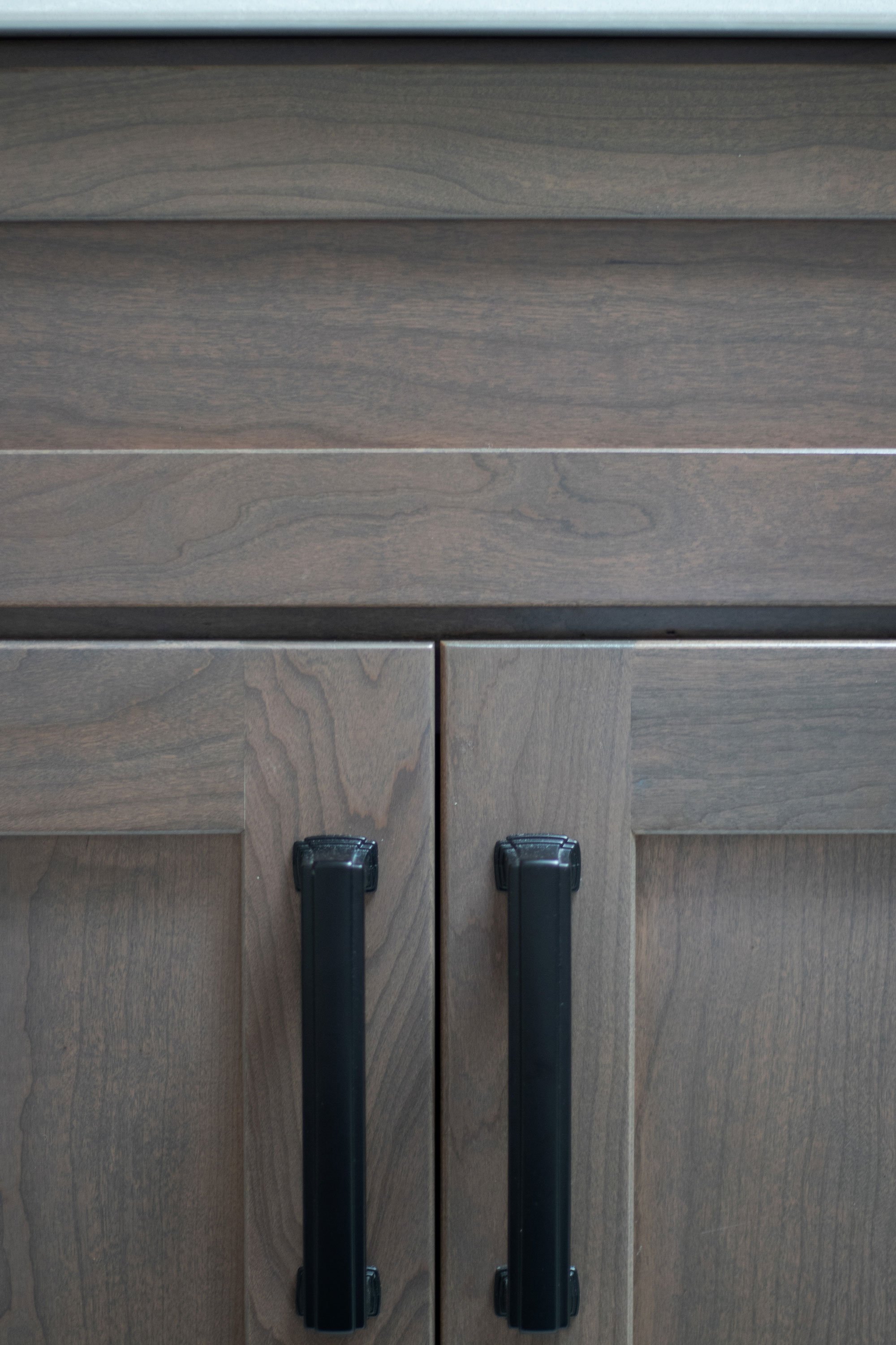 Merillat Masterpiece Martel Door style in Cherry Stained Baltic, Richelieu Matte Black hardware