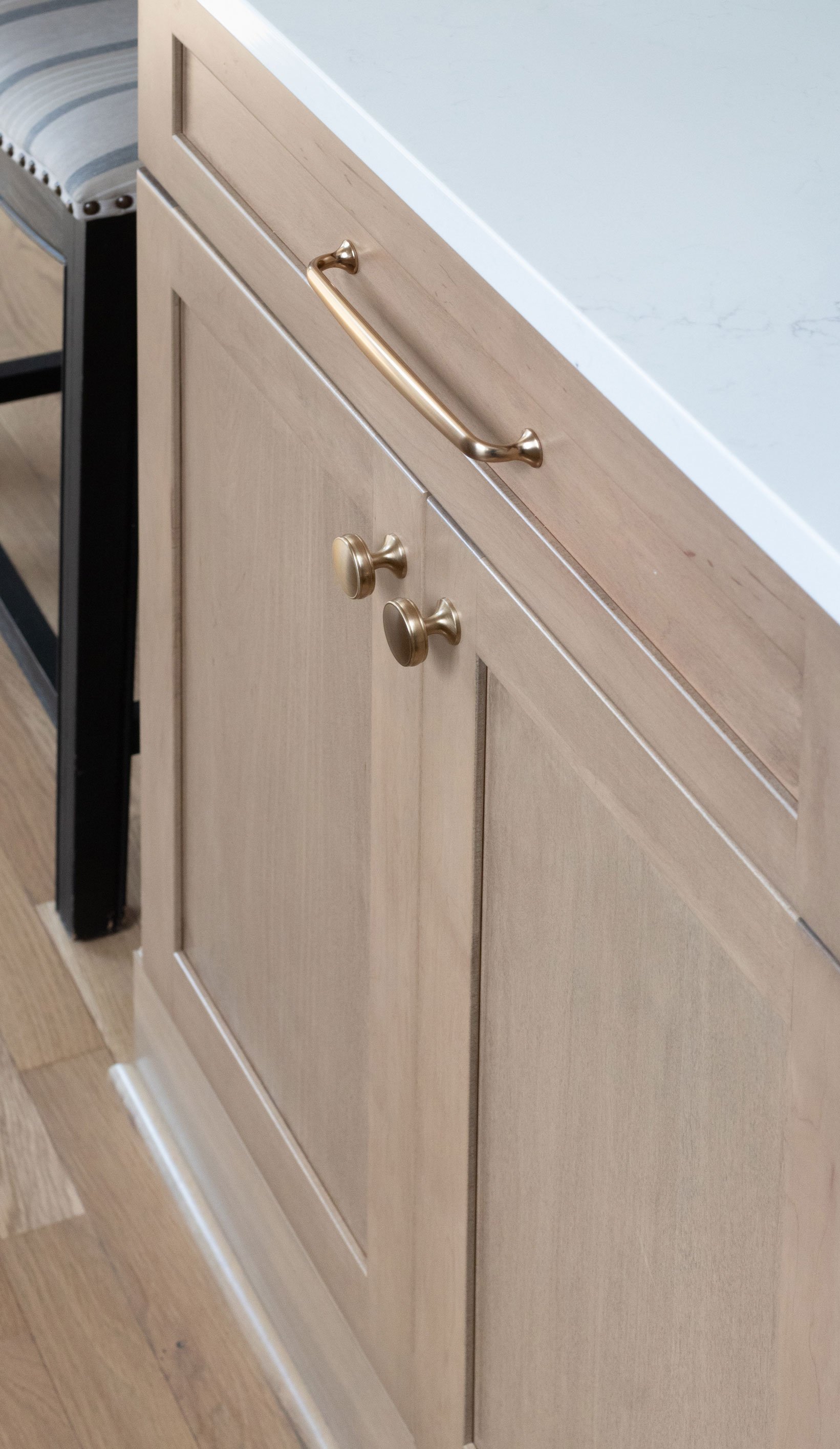Cabinetry: Merillat Masterpiece Martel Door in Maple with Wicker Stain; Countertops: French Lace Quartz